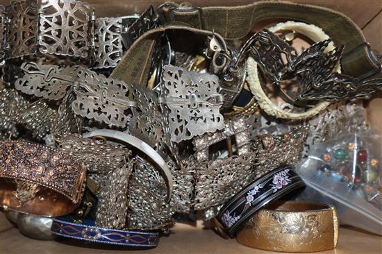 A mixed group of assorted costume jewellery and other items including bangles, plated belts, buckles, brooches etc.